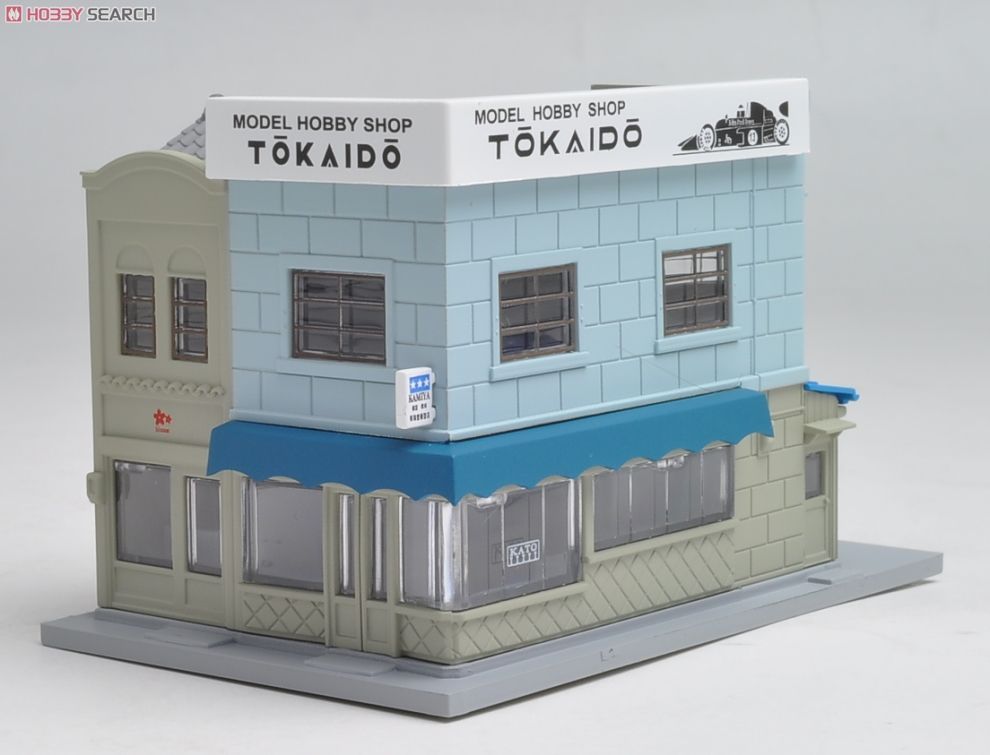 N Scale - Kato - 23-478 - 2 Story Corner Shop building - Commercial Structures - DioTown Salon + Hobby Shop (Corner Shop with Signboard 3 (Mortar/Right) (Model Shop))