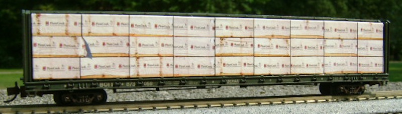 N Scale - Columbus Trainmaster - 72093N - Accessories, Load, Centerbeam,Wrapped - Painted/Lettered - Plum Creek